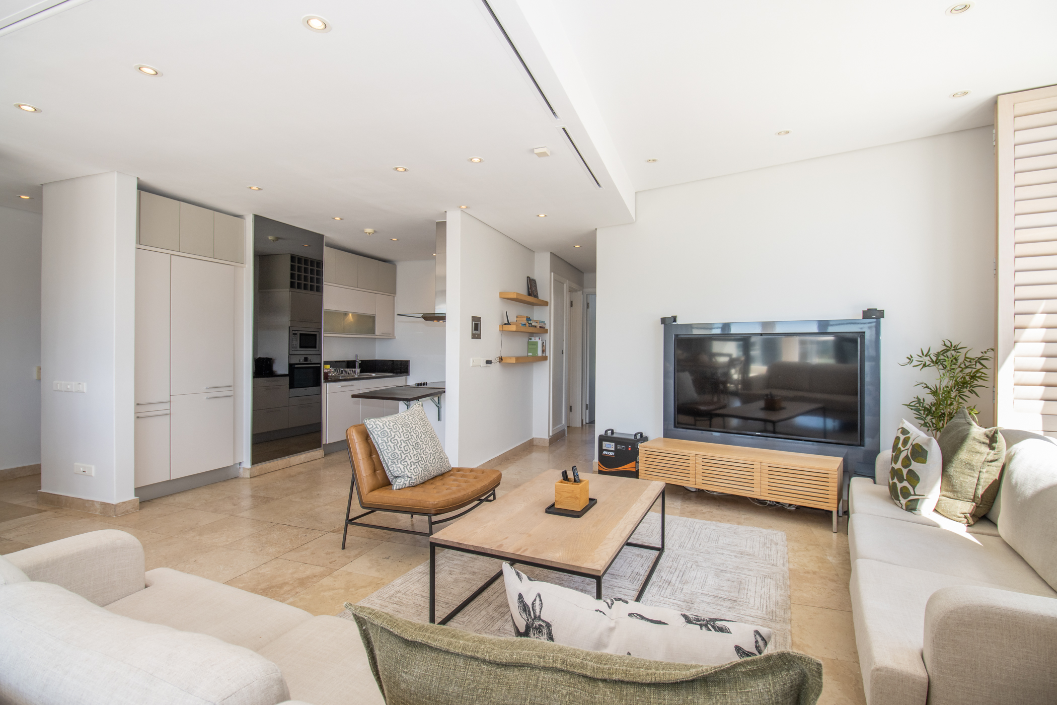 Juliette 603 TV lounge and kitchen view