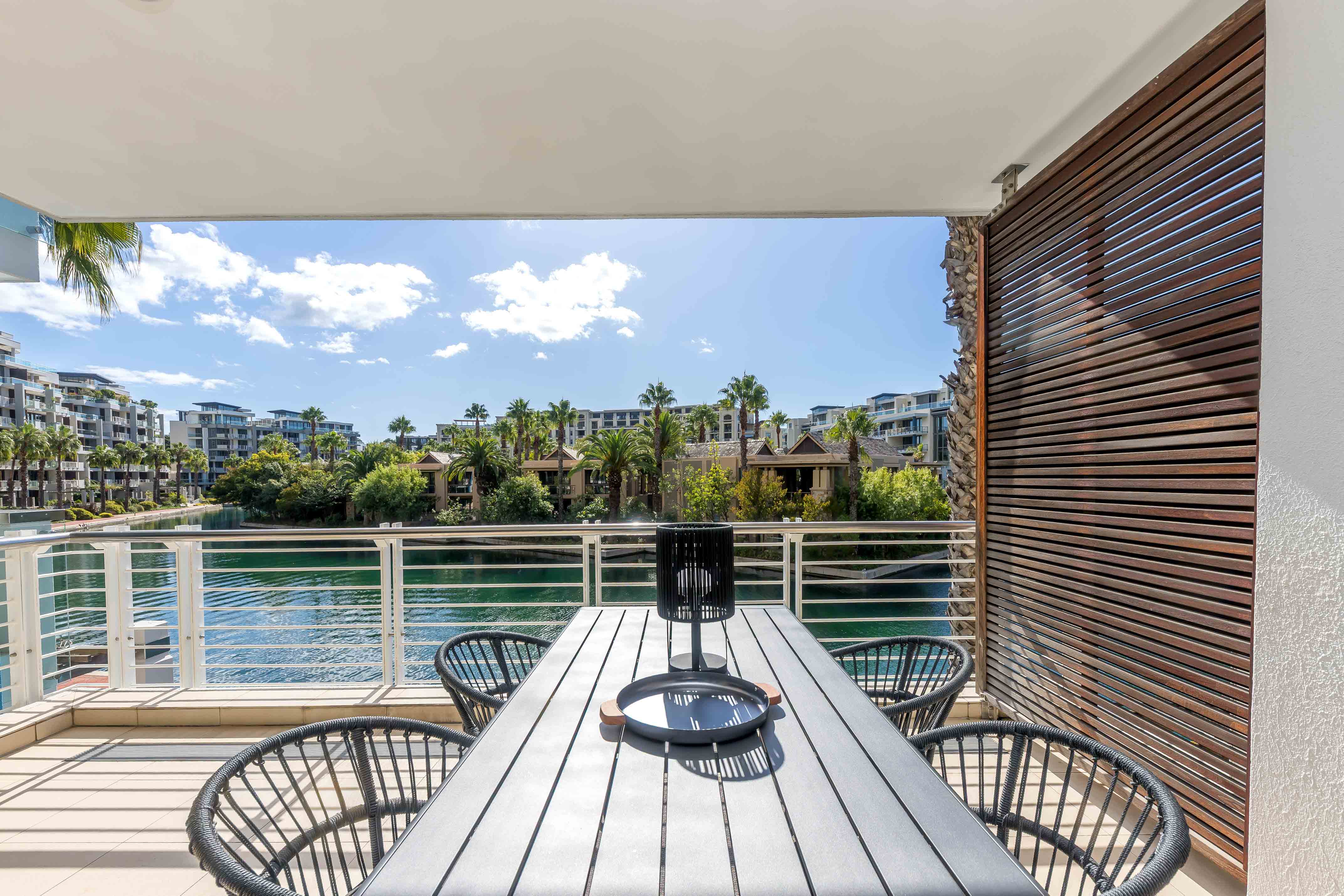 Juliette 103 outdoor dining area overlooking the Waterfront Canal