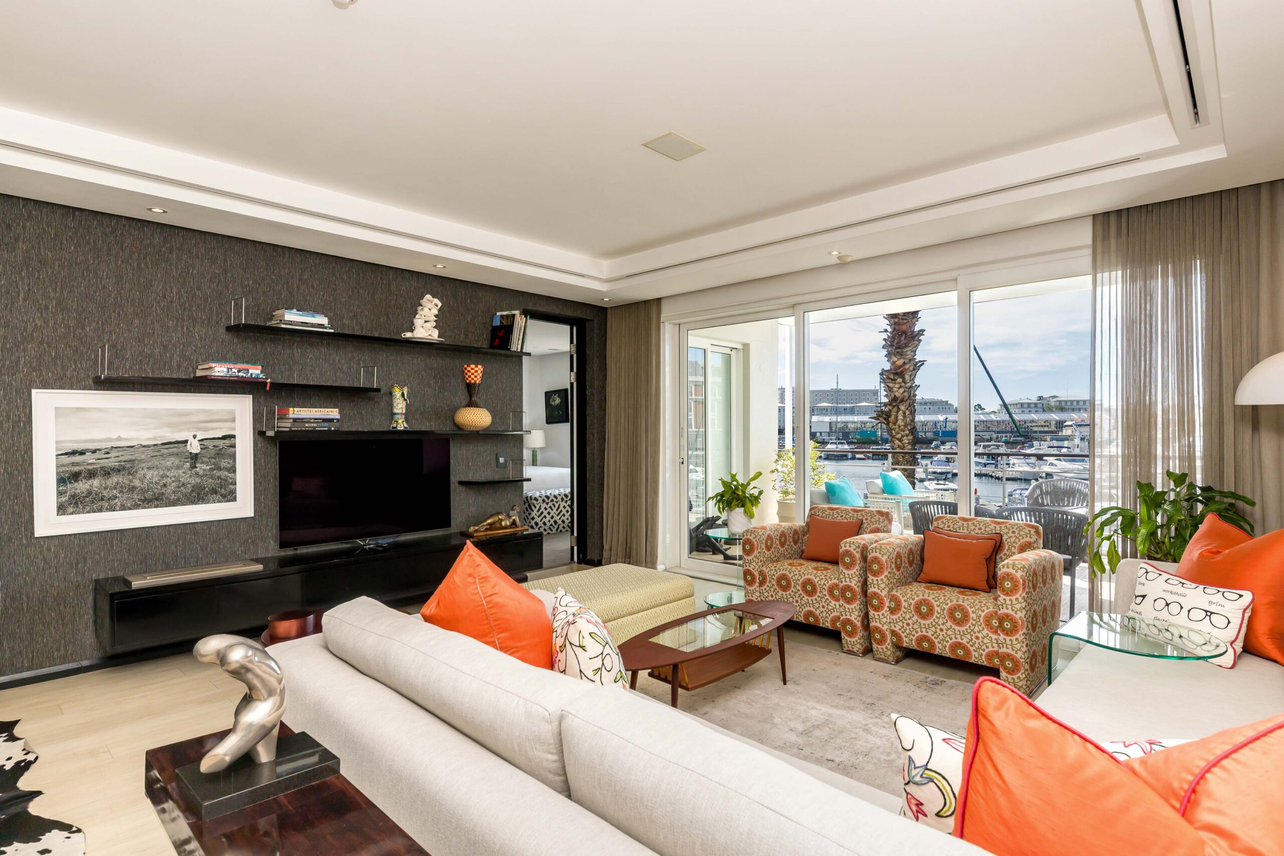 Parergon 106 living room with private balcony and marina outlook