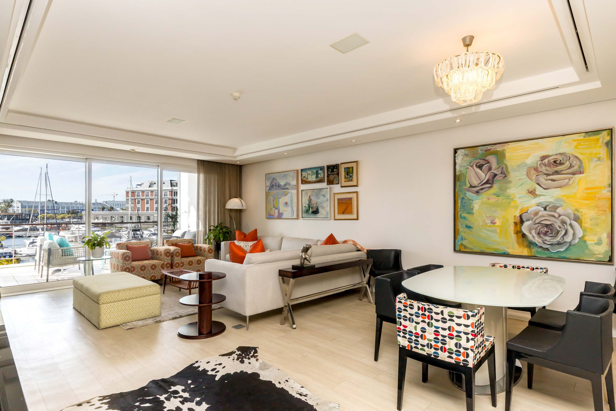 Parergon 106 open-plan living and dining area with marina view
