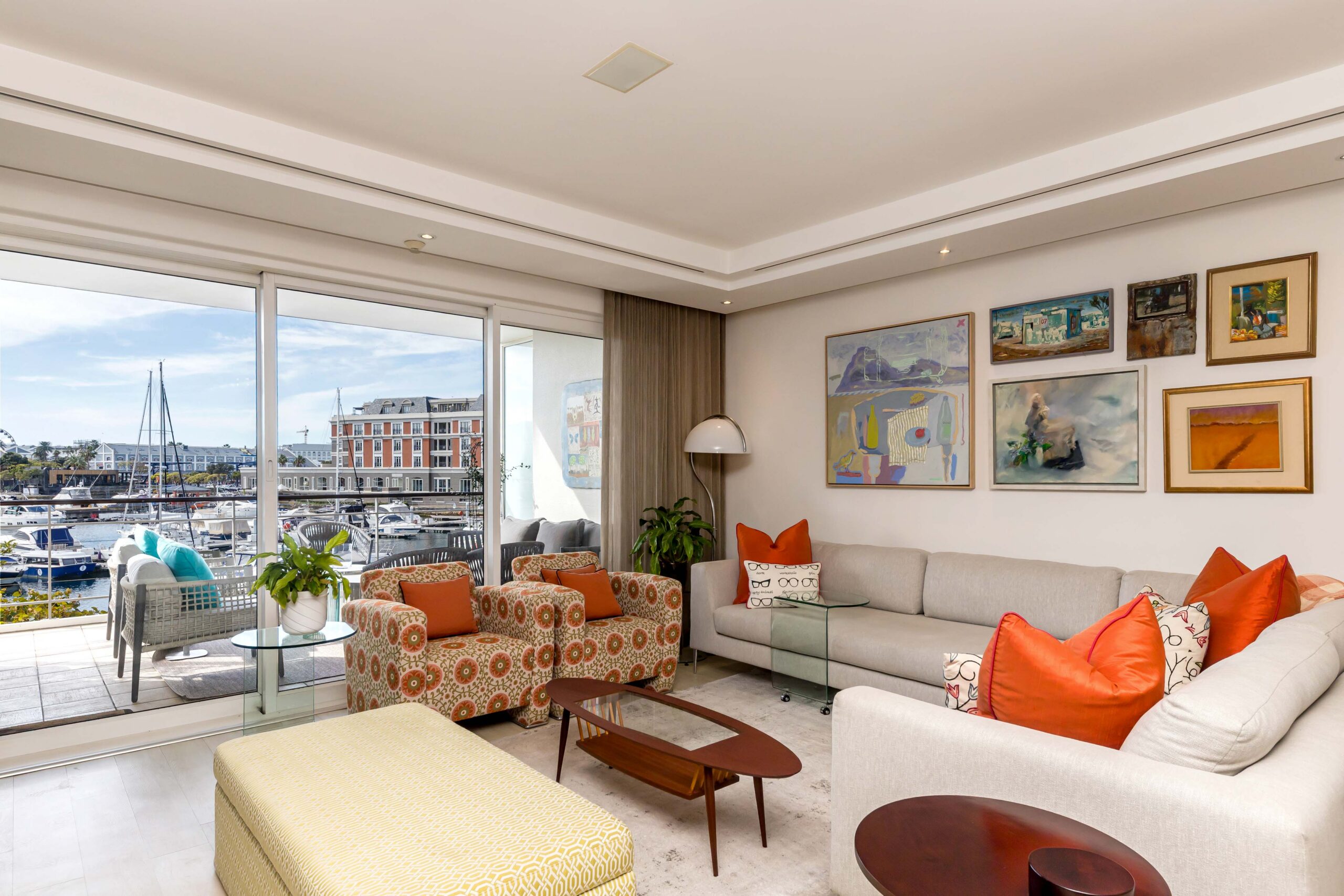 Parergon 106 living room opening towards the Waterfront Yacht Basin